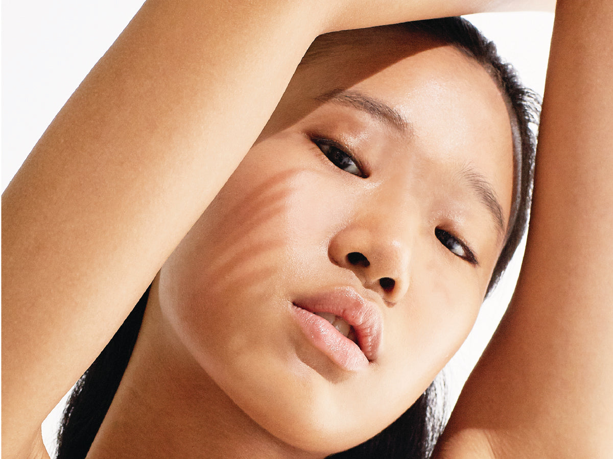 a woman's face on a white background
